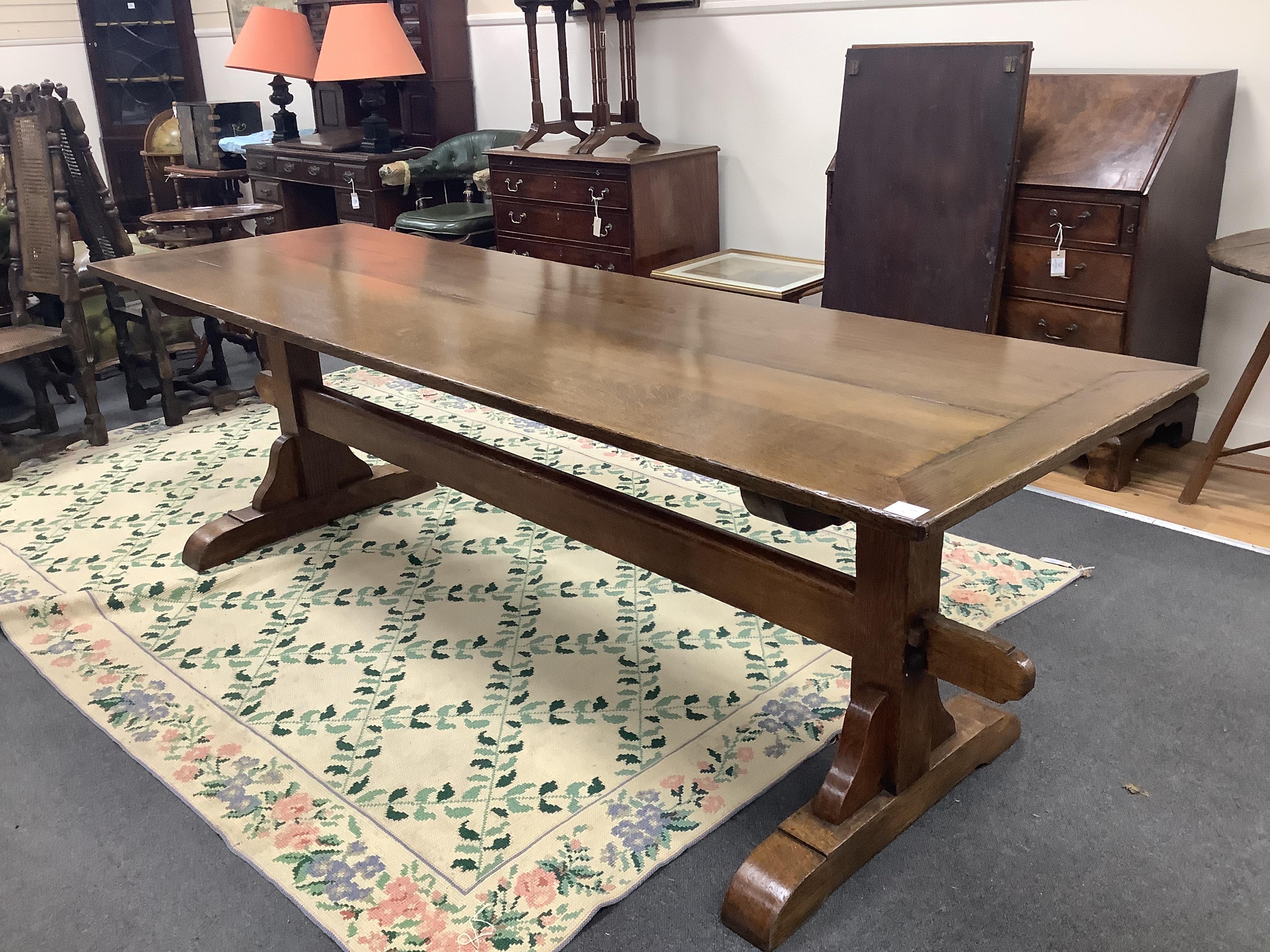 An 18th century style rectangular oak refectory style dining table, length 244cm, width 76cm, height 76cm